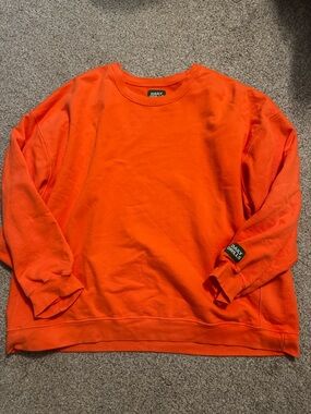 Daily drills Orange crewneck size m/l like new